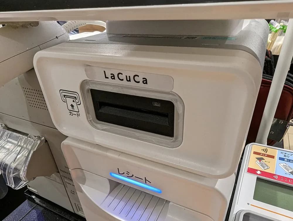 A card reader and payment unit fitted to a supermarket checkout.