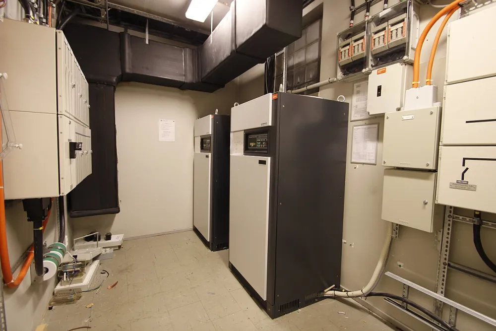 Large grey UPS cabinets in a plant room.